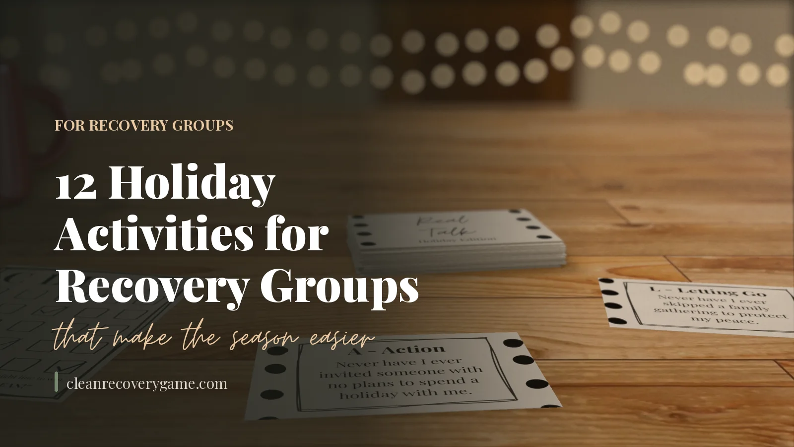 Holiday Edition Real Talk cards on a wooden table with warm string lights in the background, with the title 12 Holiday Activities for Recovery Groups That Make the Season Easier